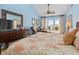 Bright bedroom with outdoor views, comfortable seating area, and coral accents offering style and relaxation at 2942 Atrium Villa Dr # 42, Johns Island, SC 29455