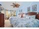 Spacious bedroom featuring two beds, a ceiling fan, and windows with natural light at 2942 Atrium Villa Dr # 42, Johns Island, SC 29455