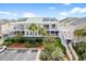 Charming condo featuring a balcony, well-maintained landscaping, and stairs to upper levels at 2942 Atrium Villa Dr # 42, Johns Island, SC 29455