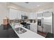 Modern kitchen featuring stainless steel appliances, sleek countertops and tiled backsplash at 2942 Atrium Villa Dr # 42, Johns Island, SC 29455