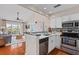Modern kitchen with open floor plan showcases stainless steel appliances and views of the living area at 2942 Atrium Villa Dr # 42, Johns Island, SC 29455