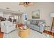 Inviting living room featuring a ceiling fan, comfortable seating, and open access to the kitchen at 2942 Atrium Villa Dr # 42, Johns Island, SC 29455