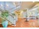 Elegant lobby featuring a grand staircase, stylish decor, and beautiful hardwood floors at 2942 Atrium Villa Dr # 42, Johns Island, SC 29455