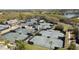 Aerial view showcasing multiple tennis courts surrounded by lush greenery and mature trees at 2942 Atrium Villa Dr # 42, Johns Island, SC 29455