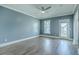 Bedroom features a ceiling fan, balcony access, and large window at 3125 Sturbridge Rd, Mount Pleasant, SC 29466