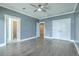 Spacious bedroom with wood floors, ceiling fan, and access to a private bathroom and walk-in closet at 3125 Sturbridge Rd, Mount Pleasant, SC 29466