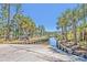Community boat ramp with easy water access, surrounded by lush greenery and palm trees at 3125 Sturbridge Rd, Mount Pleasant, SC 29466