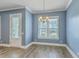 Charming dining area with door to outdoors, features a modern chandelier at 3125 Sturbridge Rd, Mount Pleasant, SC 29466
