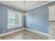 Charming dining room features a modern chandelier and ample natural light at 3125 Sturbridge Rd, Mount Pleasant, SC 29466