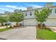 Attractive townhome with a two-car garage, manicured landscaping, and well-maintained curb appeal at 3125 Sturbridge Rd, Mount Pleasant, SC 29466