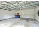 Spacious two-car garage with exposed ceiling, white walls, and a sealed concrete floor at 3125 Sturbridge Rd, Mount Pleasant, SC 29466