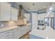 Modern kitchen with sleek stainless steel appliances, granite countertops, and designer pendant lighting at 3125 Sturbridge Rd, Mount Pleasant, SC 29466