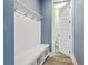 Convenient mudroom entry featuring bench, storage, and a half bath at 3125 Sturbridge Rd, Mount Pleasant, SC 29466