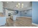 Open floor plan showcasing a modern kitchen flowing seamlessly into the spacious living area at 3125 Sturbridge Rd, Mount Pleasant, SC 29466