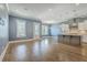 Expansive open floor plan featuring hardwood floors, modern lighting, and a combined living and kitchen area at 3125 Sturbridge Rd, Mount Pleasant, SC 29466
