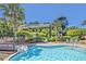Community pool area with water slide, slide and tower amidst lush landscaping at 3125 Sturbridge Rd, Mount Pleasant, SC 29466