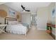 Comfortable bedroom featuring a black bed frame, light wood floors, and ample natural light at 316 Anadale Ct, North Charleston, SC 29418