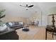 Bright living room features vaulted ceilings, ceiling fan, two couches, accent rug, and a leafy green houseplant at 316 Anadale Ct, North Charleston, SC 29418