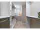 Walk-in closet featuring white shelving, hanging rods, and tile flooring at 316 Anadale Ct, North Charleston, SC 29418