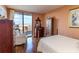 Comfortable bedroom with hardwood floors, a large window, and elegant furnishings at 330 Concord St # 8E, Charleston, SC 29401