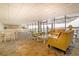 Large common area with comfortable seating and views of the water and nearby docks at 330 Concord St # 8E, Charleston, SC 29401