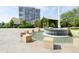 Relax by the lovely water fountain with shaded seating areas amidst lush landscaping at 330 Concord St # 8E, Charleston, SC 29401