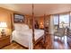 Main bedroom featuring a four-poster bed, hardwood floors, and views of the city at 330 Concord St # 8E, Charleston, SC 29401