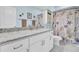 Charming bathroom featuring granite countertops, white cabinets, and a shower with a delightful starfish-themed curtain at 3473 Plow Ground Rd, Johns Island, SC 29455