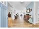 Inviting foyer featuring beautiful wood floors and views into the living and dining areas at 3473 Plow Ground Rd, Johns Island, SC 29455