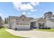 Charming single-story home with a well-maintained lawn and an attached garage at 3473 Plow Ground Rd, Johns Island, SC 29455