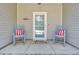 Inviting front porch with rocking chairs and coastal decor at 3473 Plow Ground Rd, Johns Island, SC 29455
