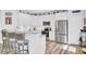Bright and modern kitchen featuring white cabinets, stainless steel appliances, and a granite island at 3473 Plow Ground Rd, Johns Island, SC 29455