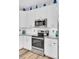 Modern kitchen featuring granite countertops, stainless steel appliances, and light wood flooring at 3473 Plow Ground Rd, Johns Island, SC 29455