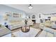 Open living area with comfortable seating and ample natural light, flowing into the kitchen at 3473 Plow Ground Rd, Johns Island, SC 29455