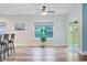 Bright living room boasts wood floors, recessed lighting, and large windows offering abundant natural light at 3473 Plow Ground Rd, Johns Island, SC 29455