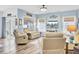Relaxing living room with ample seating, natural light, and a sliding glass door leading to an outdoor space at 3473 Plow Ground Rd, Johns Island, SC 29455