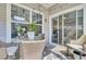 Cozy patio area with wicker furniture, perfect for outdoor relaxation and enjoying views of the beautiful backyard at 3473 Plow Ground Rd, Johns Island, SC 29455