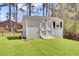 White outbuilding with double doors provides tons of secure outdoor storage at 3473 Plow Ground Rd, Johns Island, SC 29455