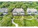 Aerial view shows spacious townhouse with private balconies surrounded by dense trees and garden landscape at 3560 Shipwatch Rd, Kiawah Island, SC 29455