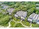 Aerial view showcases the townhouse, lush landscaping, and walkways of this beautiful community at 3560 Shipwatch Rd, Kiawah Island, SC 29455