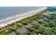Serene aerial view shows townhouses alongside a pristine beach at 3560 Shipwatch Rd, Kiawah Island, SC 29455