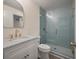 Elegant bathroom with a glass shower door, marble countertop, and modern gold-tone fixtures at 3560 Shipwatch Rd, Kiawah Island, SC 29455