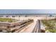 Scenic beach access with a wooden walkway leading to a serene shoreline with beachgoers enjoying the sun at 3560 Shipwatch Rd, Kiawah Island, SC 29455
