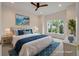 Staged primary bedroom with a large window for natural light and coastal-inspired decor at 3560 Shipwatch Rd, Kiawah Island, SC 29455