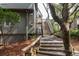 Charming exterior view of a multi-level home with wooden stairs and lush landscaping at 3560 Shipwatch Rd, Kiawah Island, SC 29455