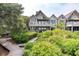 Charming multi-level home with balconies surrounded by lush greenery and a wooden walkway at 3560 Shipwatch Rd, Kiawah Island, SC 29455
