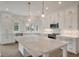 Kitchen with a large island, marble countertops, stainless appliances and ample cabinet space at 3560 Shipwatch Rd, Kiawah Island, SC 29455