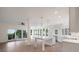 Bright, open-concept living space connecting kitchen, dining, and living areas with natural light and outdoor access at 3560 Shipwatch Rd, Kiawah Island, SC 29455