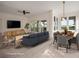Staged open-concept living room and dining area with a modern aesthetic and seamless flow at 3560 Shipwatch Rd, Kiawah Island, SC 29455