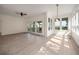 Bright and airy living room with large windows offering scenic outdoor views and a walkout at 3560 Shipwatch Rd, Kiawah Island, SC 29455